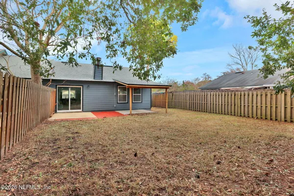 a view of backyard with green space