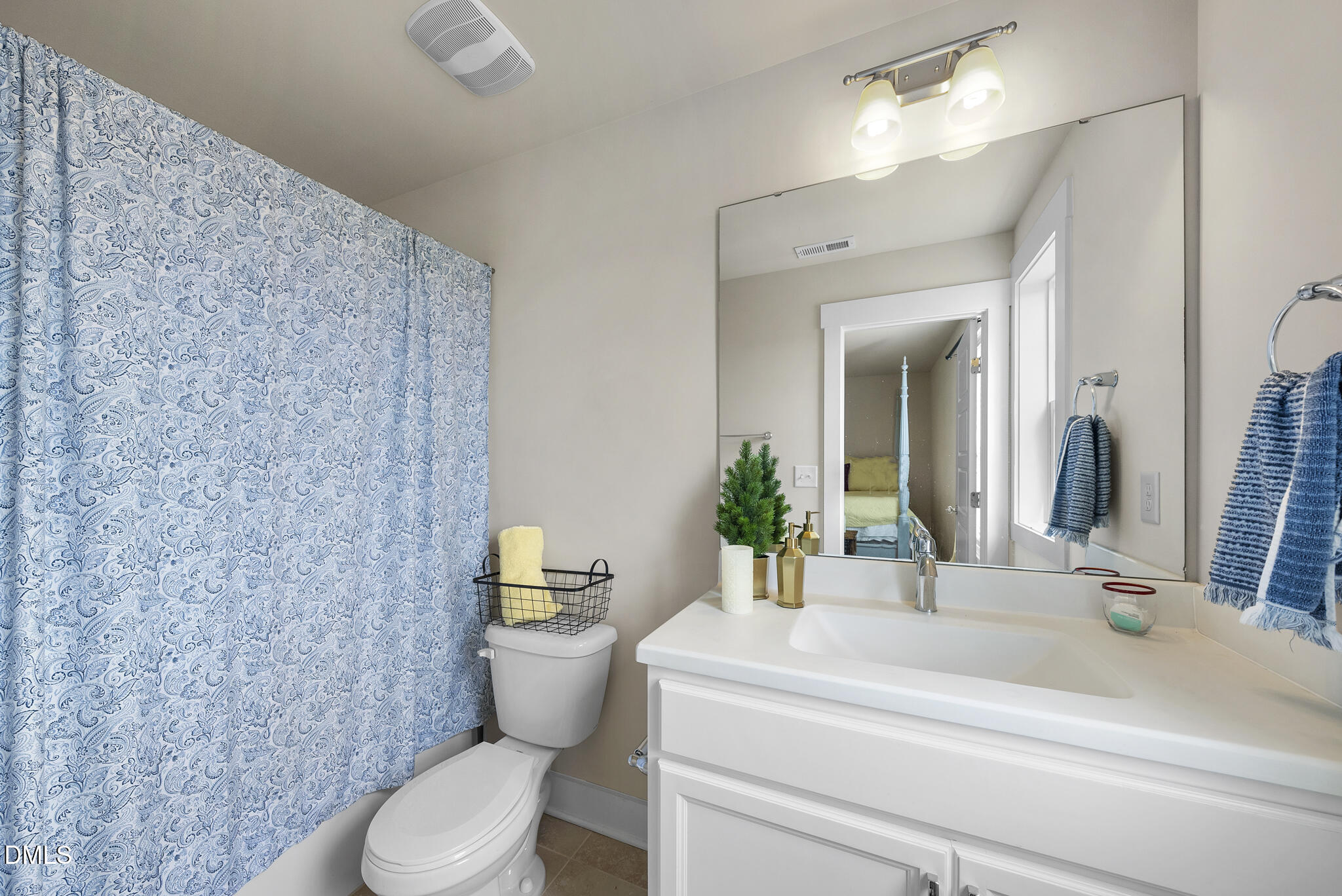 1985 Big Falls Drive Wendell, NC 27591 - Photo 16 of 24 a bathroom with a sink a toilet a mirror and shower