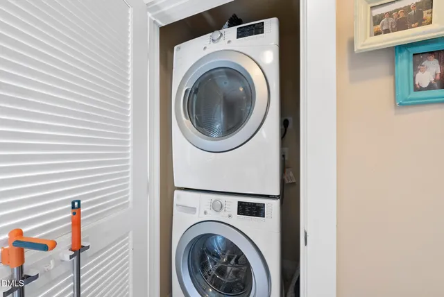 a view of a porch with chairs and potted plants