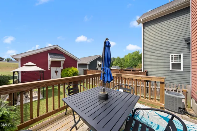 a view of a house with backyard and porch