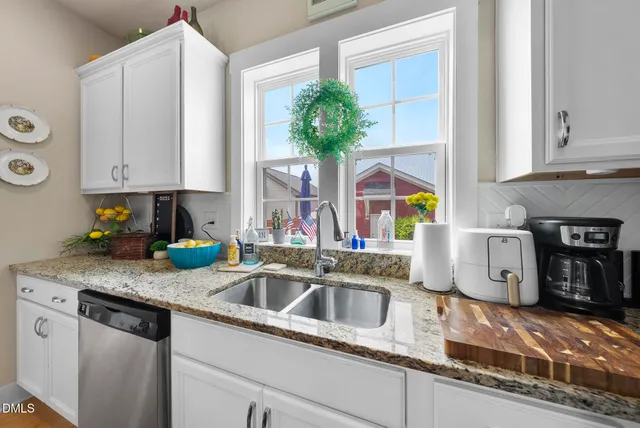 a kitchen with a stove and a microwave