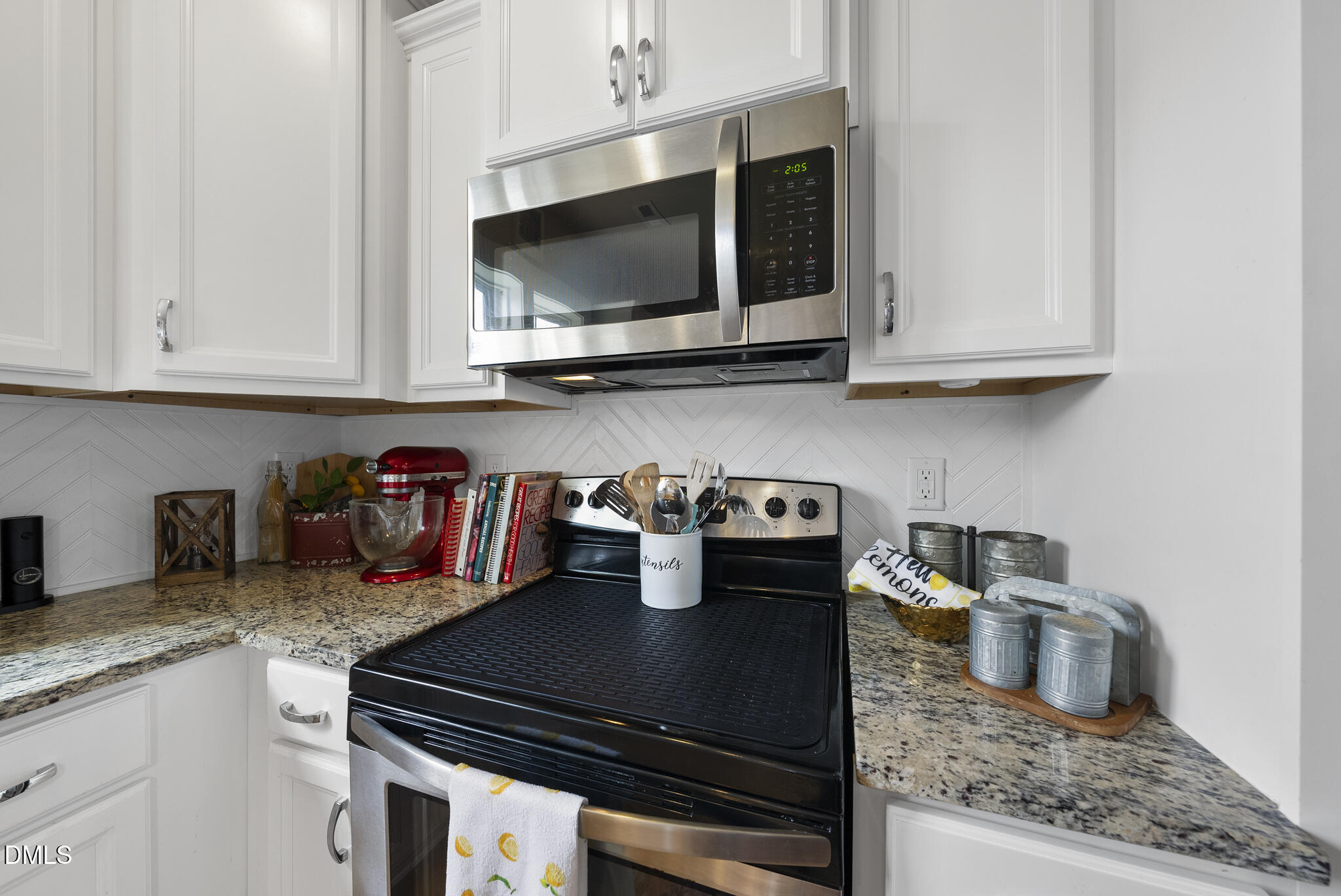 1985 Big Falls Drive Wendell, NC 27591 - Photo 5 of 24 a kitchen with a stove and a microwave
