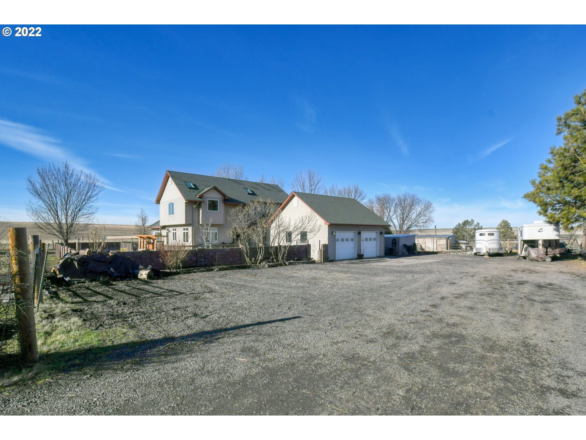 48903 Cayuse Road Pendleton, OR 97801 - Photo 2 of 32 a view of a house with a yard