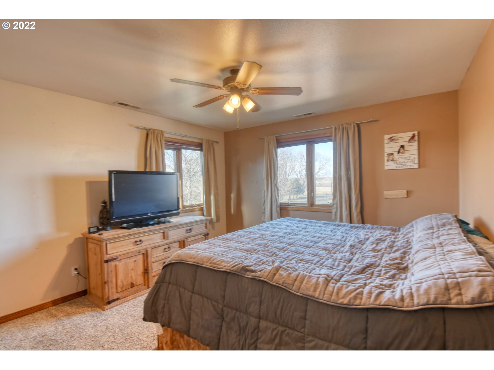 48903 Cayuse Road Pendleton, OR 97801 - Photo 28 of 32 a bedroom with a bed and a flat screen tv