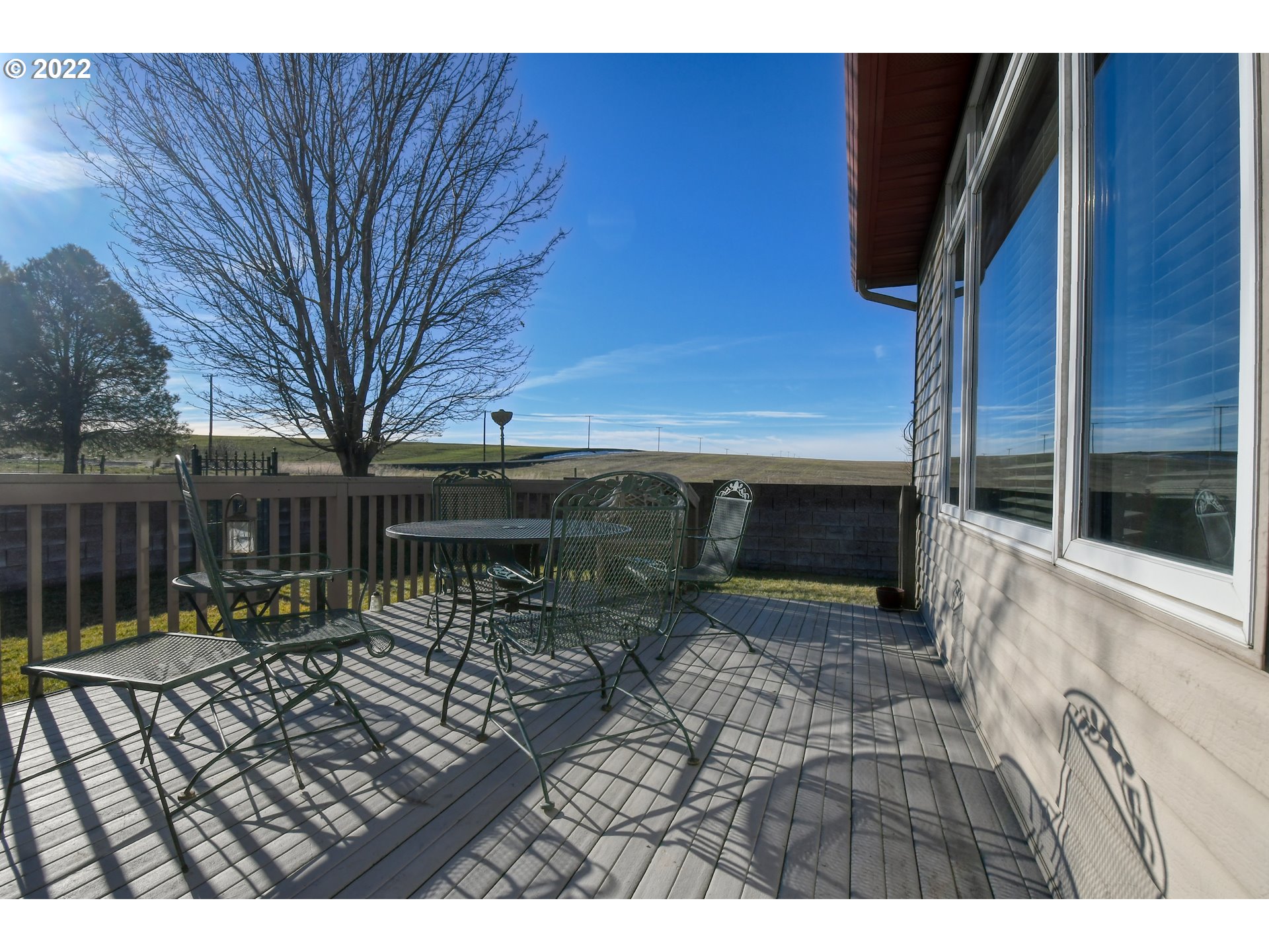 48903 Cayuse Road Pendleton, OR 97801 - Photo 31 of 32 a backyard of a house with barbeque oven and outdoor seating