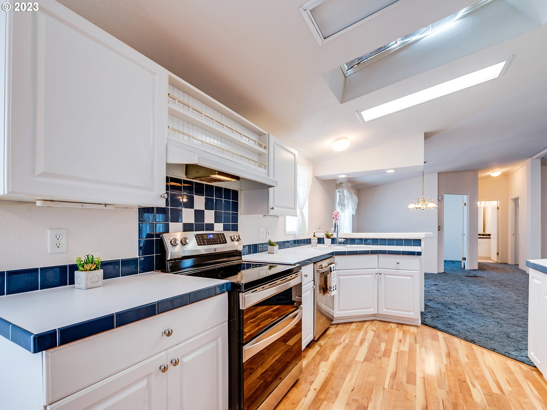 2267 Maia Loop Springfield, OR 97477 - Photo 7 of 15 a kitchen with a sink a stove top oven and cabinets