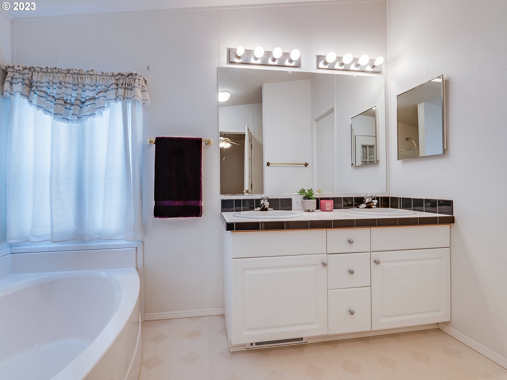 2267 Maia Loop Springfield, OR 97477 - Photo 10 of 15 a bathroom with a tub sink and mirror