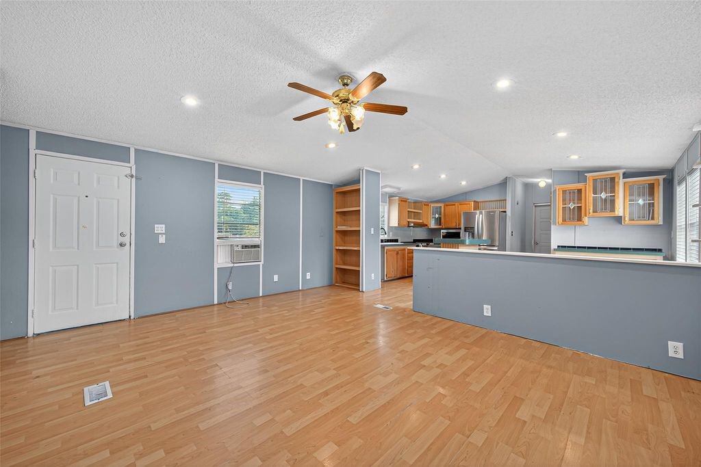 451 Trails End Drive Cleveland, TX 77328 - Photo 16 of 28 a view of a kitchen with a sink and cabinet