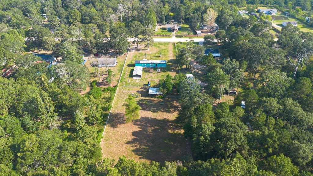 451 Trails End Drive Cleveland, TX 77328 - Photo 26 of 28 a view of a yard with swimming pool