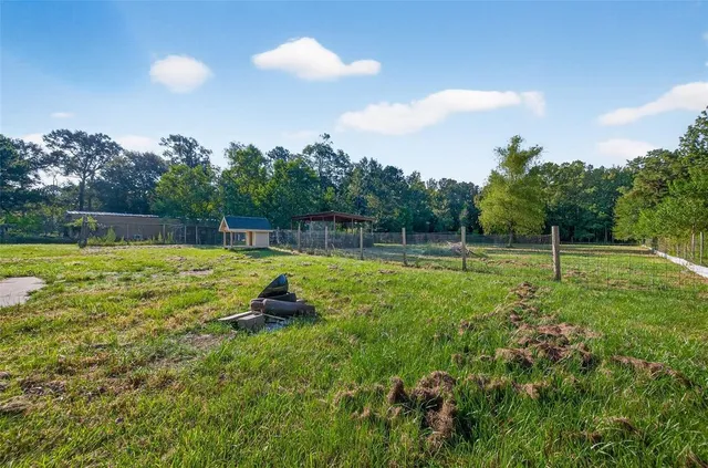 a swimming pool with some trees in the background