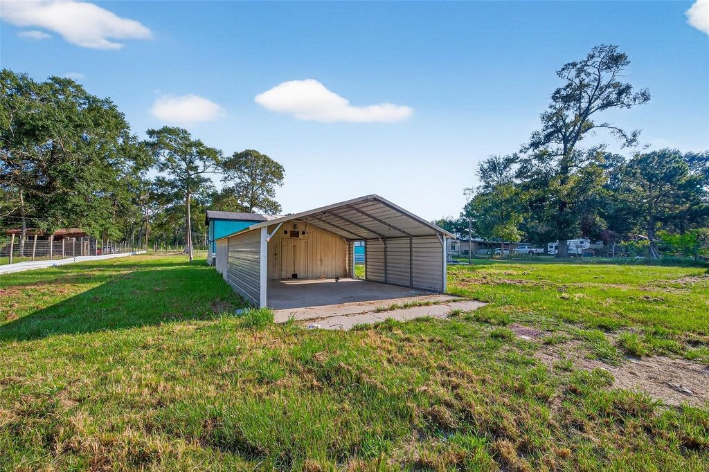 451 Trails End Drive Cleveland, TX 77328 - Photo 6 of 28 a view of a house with a yard