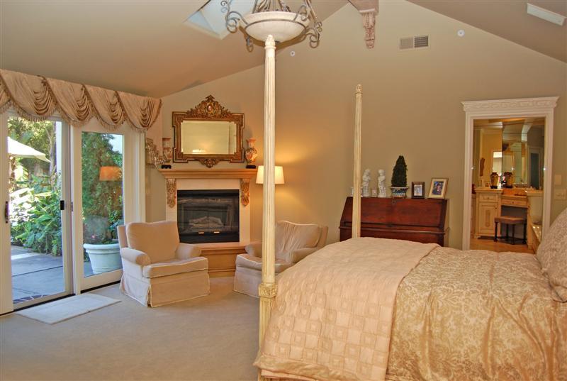 150 Middle Road Montecito, CA 93108 - Photo 8 of 12 a bedroom with a bed and a fireplace