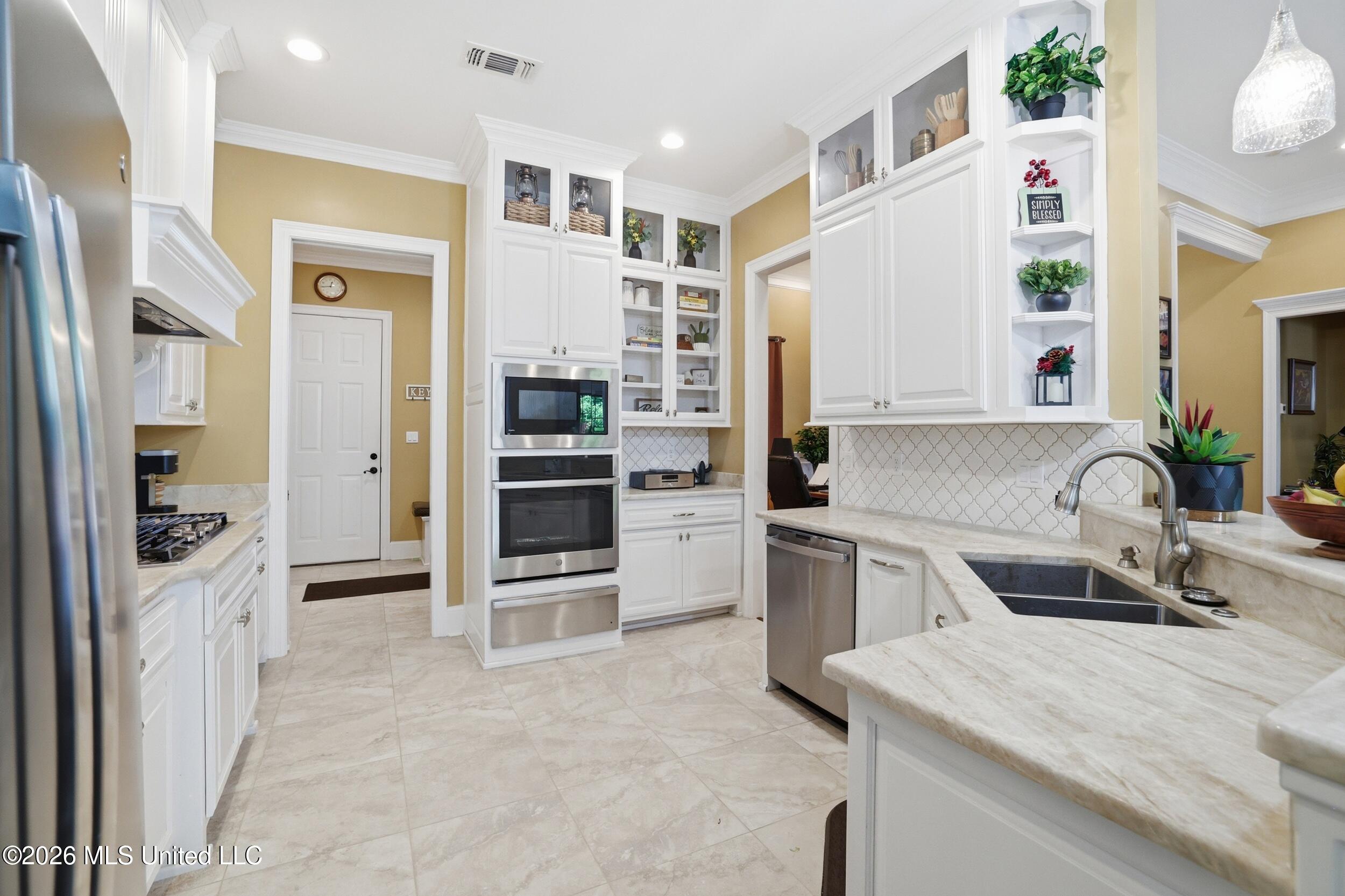 1584 Lucius Street Biloxi, MS 39532 - Photo 22 of 47 KITCHEN WITH GLAZED CERAMIC TILE