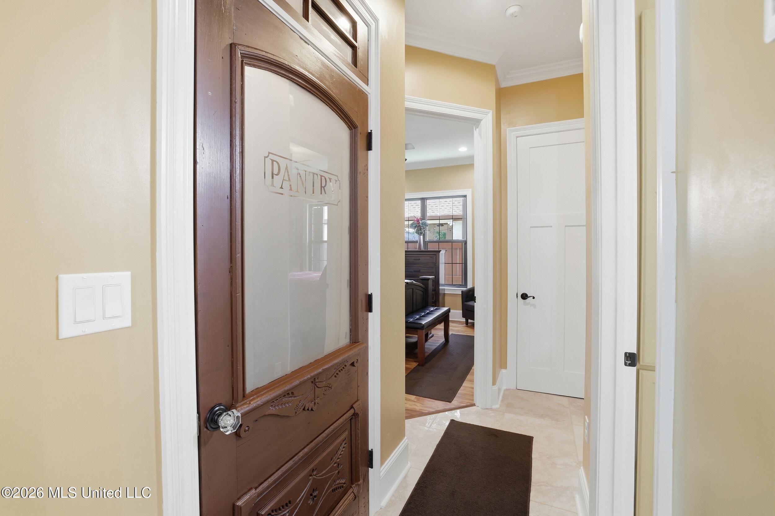 1584 Lucius Street Biloxi, MS 39532 - Photo 26 of 47 PANTRY ROOM DOOR WITH GLASS.