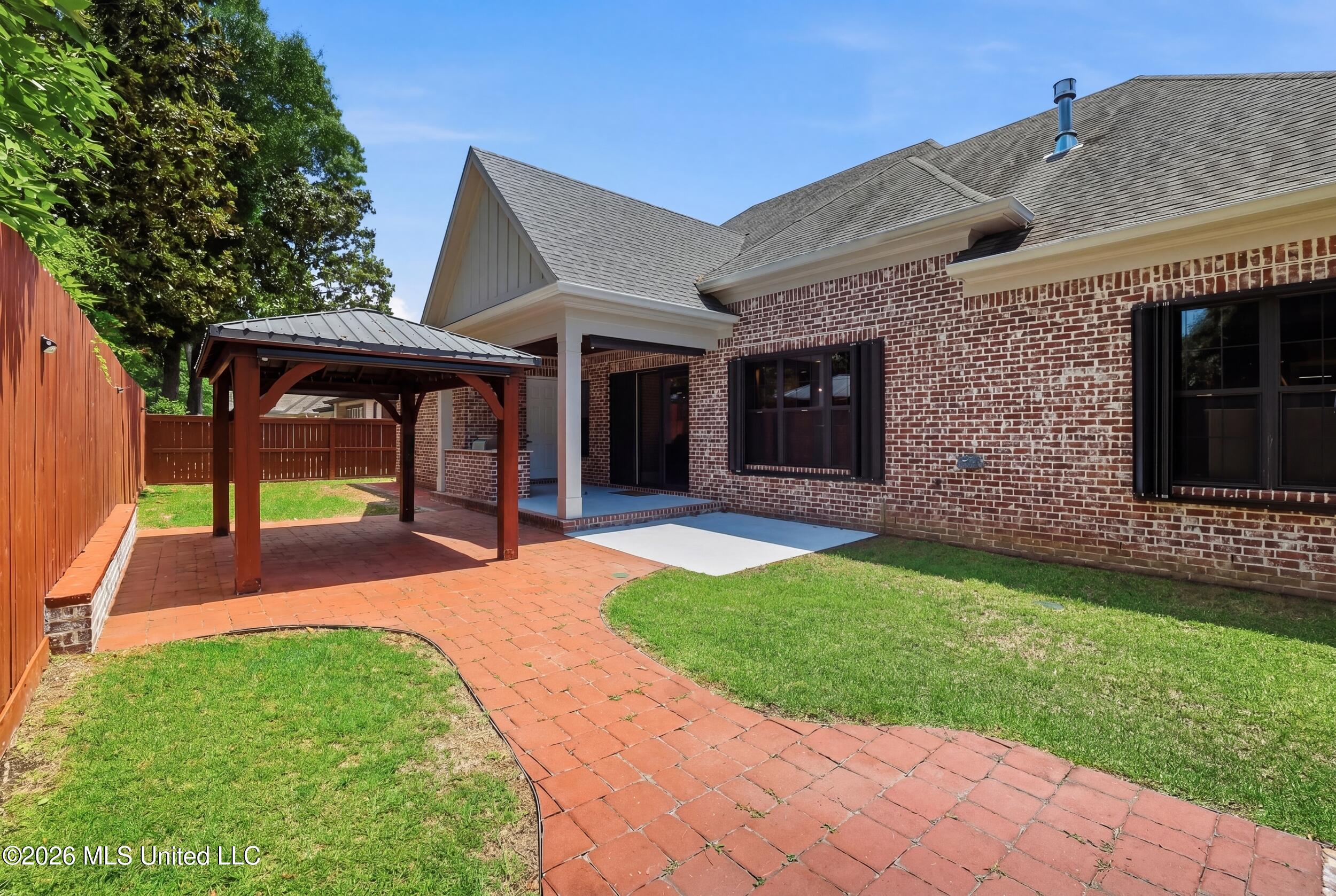 1584 Lucius Street Biloxi, MS 39532 - Photo 8 of 47 COVERED BACK PATIO, AND PERGOLA.