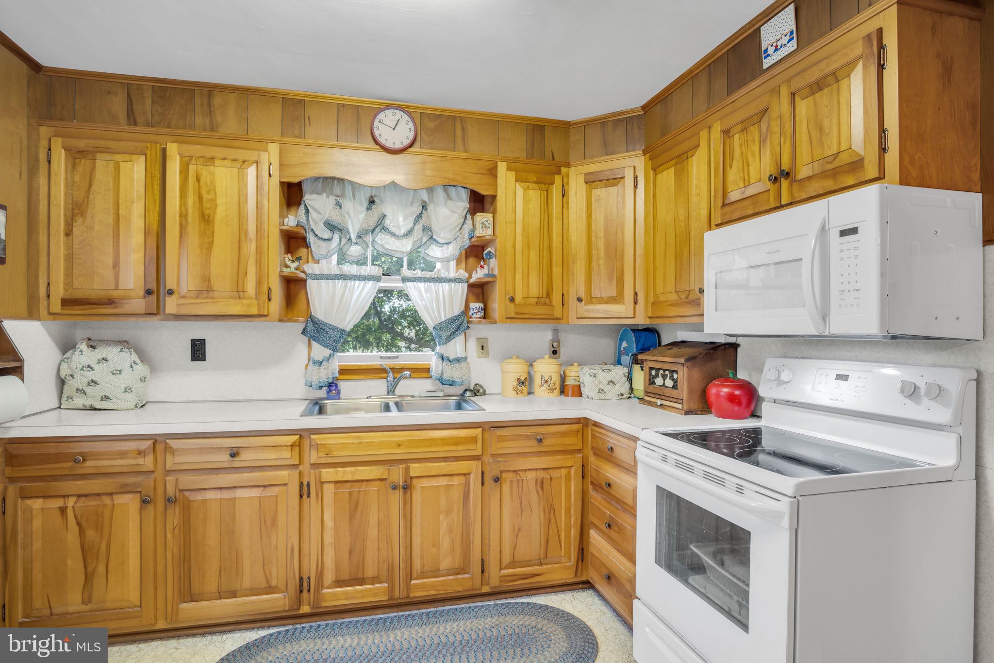 2740 Enola Road Carlisle, PA 17015 - Photo 4 of 4 a kitchen with stainless steel appliances granite countertop a stove and a white cabinets