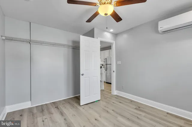 a view of an empty room and wooden floor