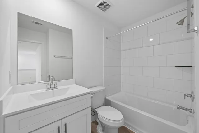 a bathroom with a sink toilet and bathtub