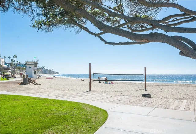 a view of a swimming pool with a lawn chairs