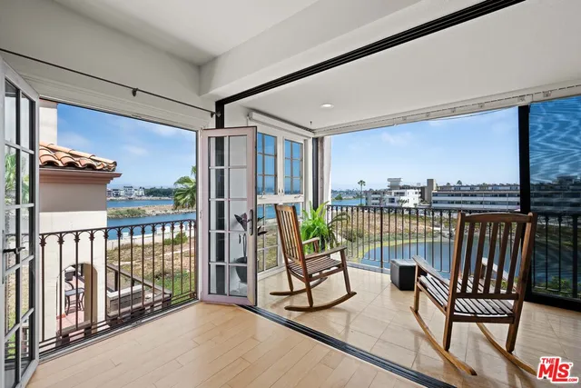 a view of balcony with furniture