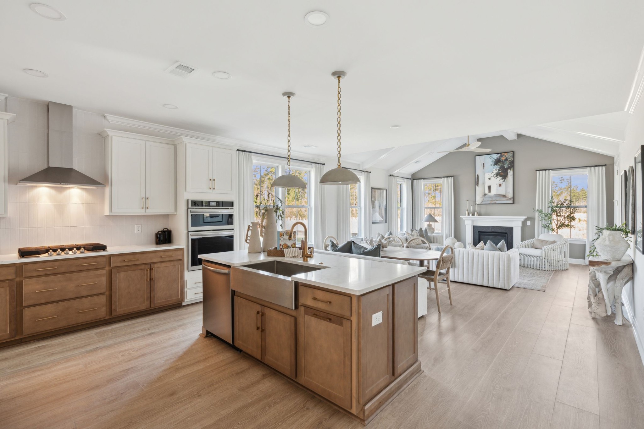 814 Sugarbush Lane Spring Hill, TN 37174 - Photo 24 of 80 a kitchen with stainless steel appliances granite countertop a stove a sink dishwasher a refrigerator white cabinets with wooden floor