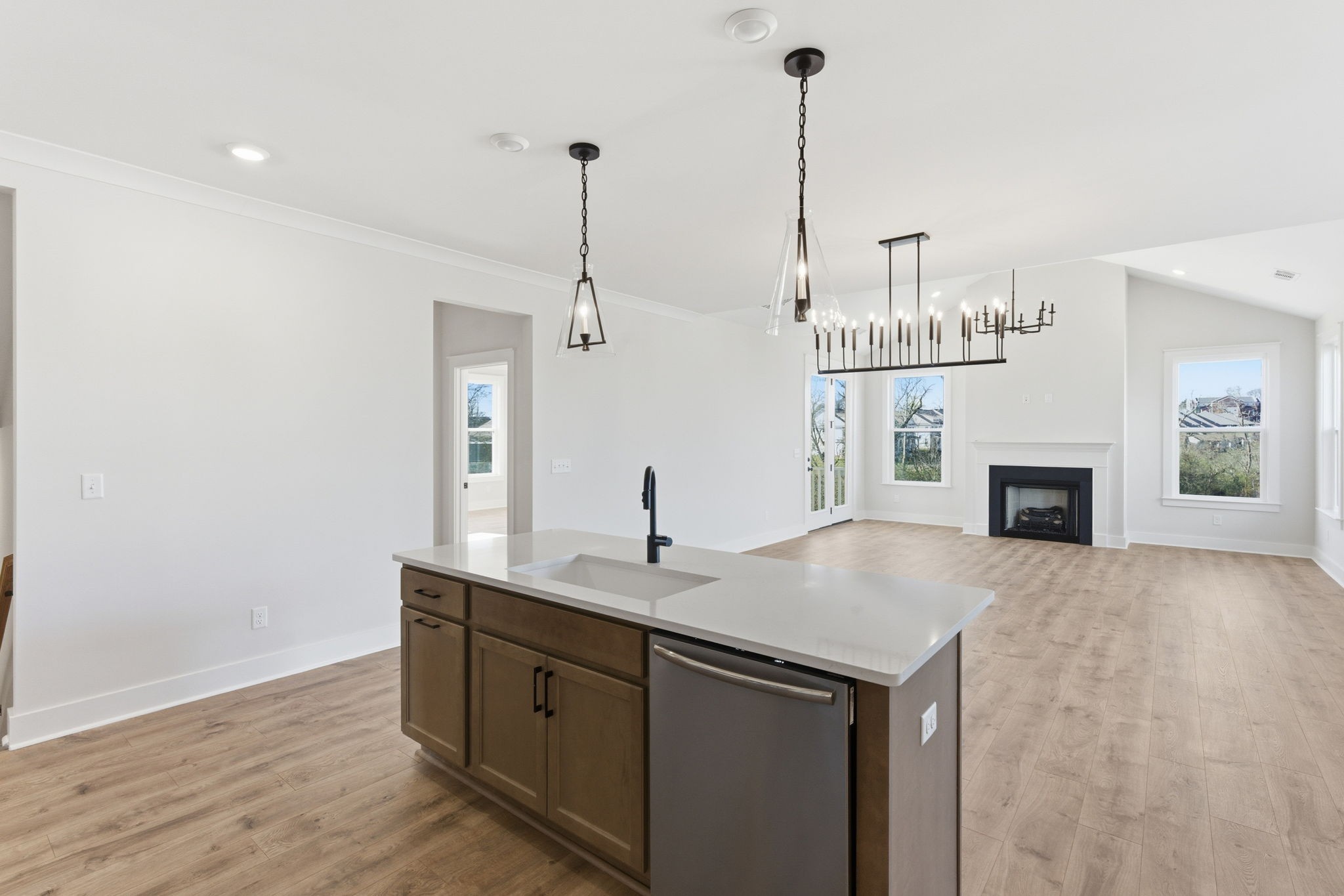 814 Sugarbush Lane Spring Hill, TN 37174 - Photo 32 of 80 a kitchen with kitchen island a sink stainless steel appliances and wooden floor
