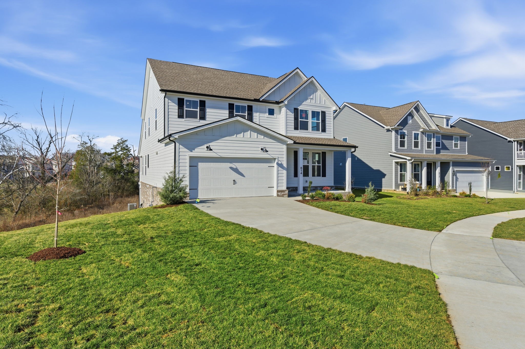 814 Sugarbush Lane Spring Hill, TN 37174 - Photo 4 of 80 a front view of a house with a yard and garage