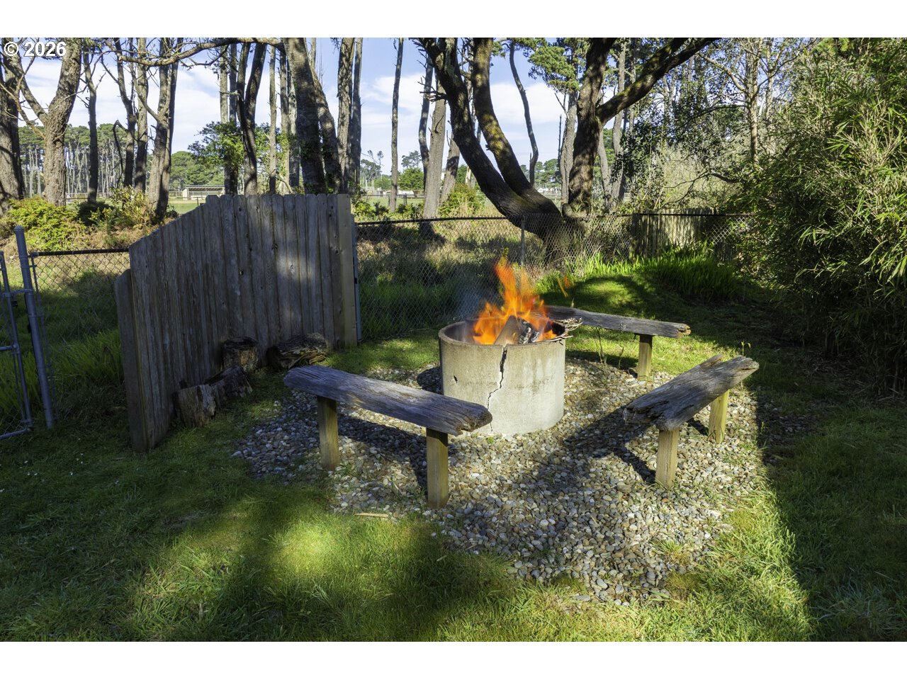 1260 Jackson Avenue Southwest Bandon, OR 97411 - Photo 13 of 48 a garden view with a sitting space