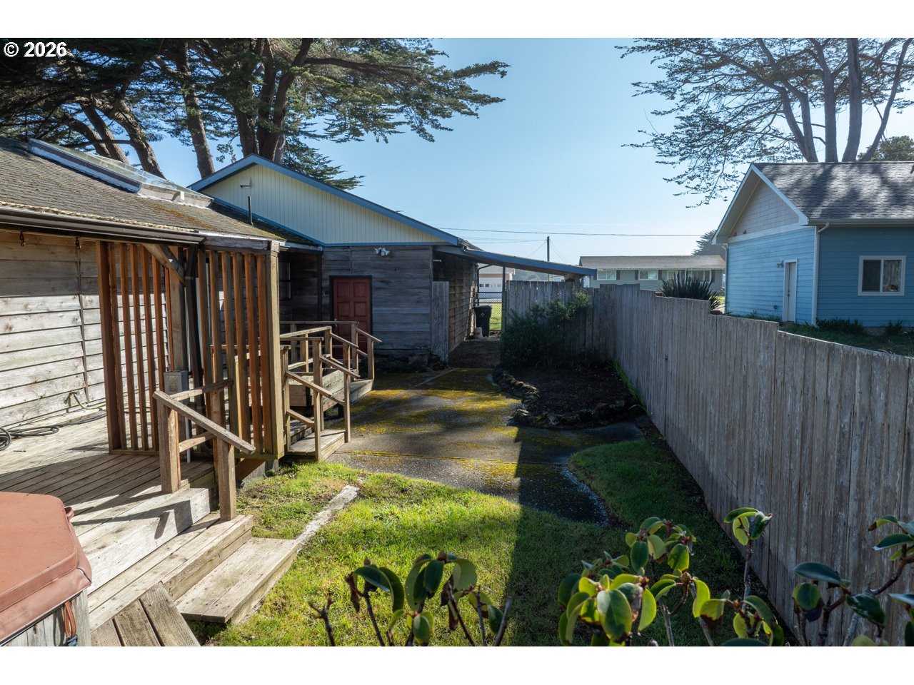 1260 Jackson Avenue Southwest Bandon, OR 97411 - Photo 15 of 48 a view of a house with backyard and sitting area