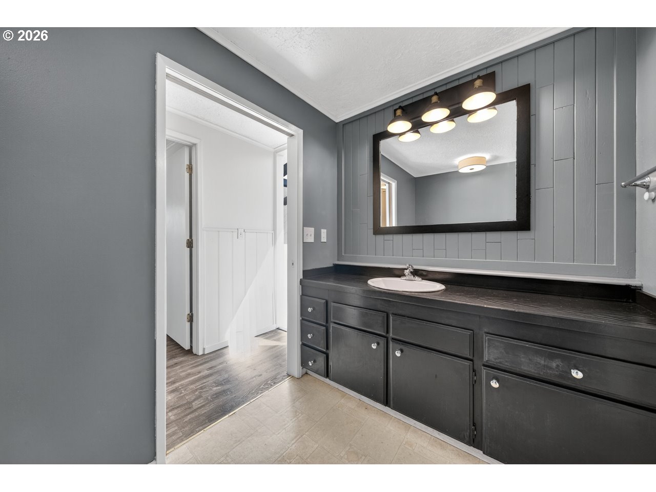 1260 Jackson Avenue Southwest Bandon, OR 97411 - Photo 29 of 48 a bathroom with a sink and mirror