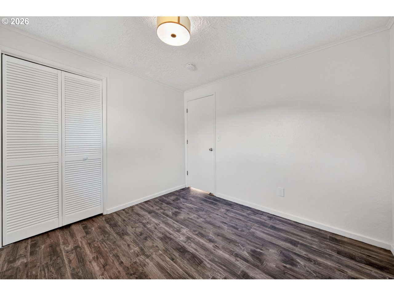1260 Jackson Avenue Southwest Bandon, OR 97411 - Photo 36 of 48 a view of an empty room and wooden floor