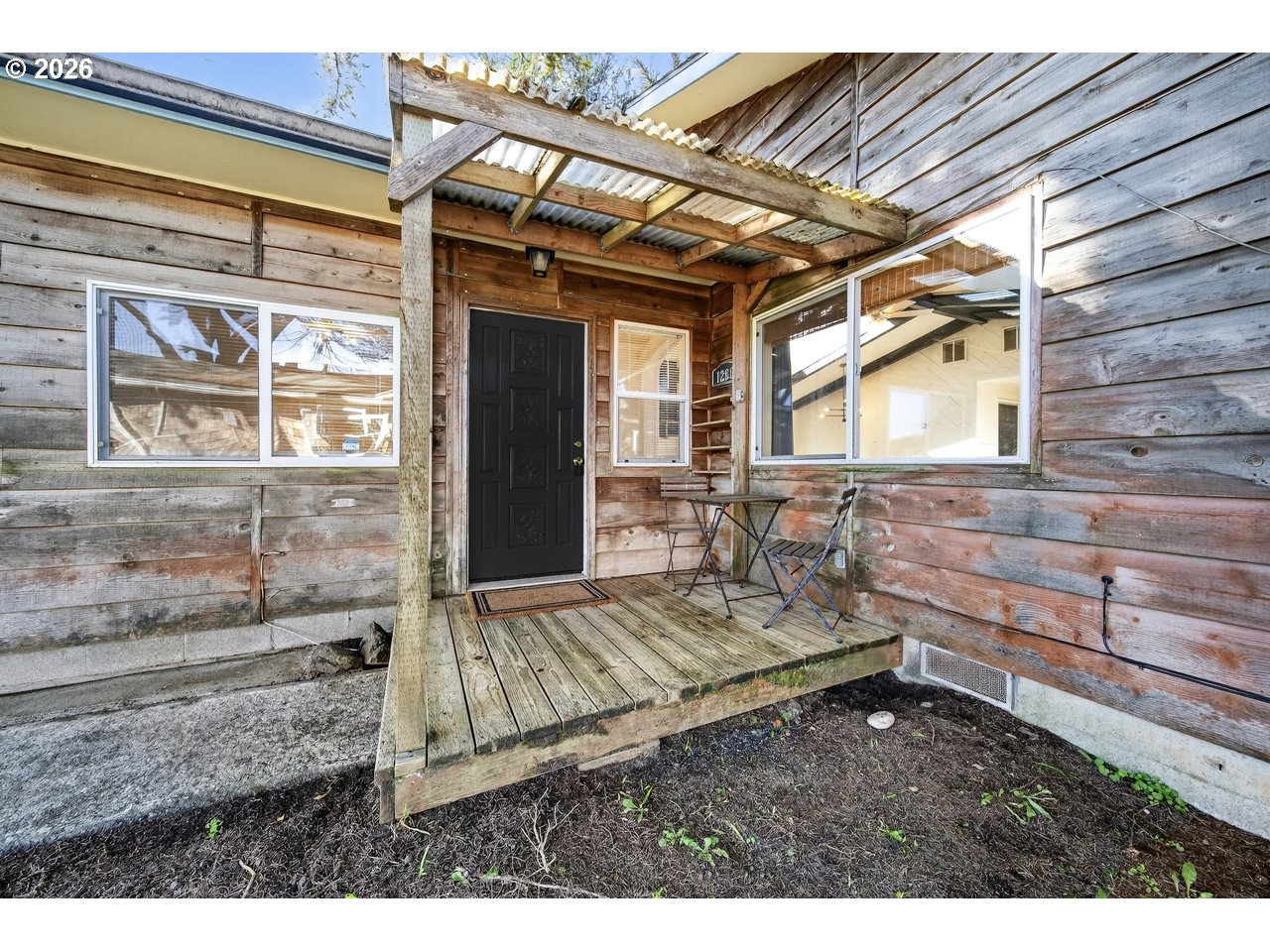 1260 Jackson Avenue Southwest Bandon, OR 97411 - Photo 47 of 48 a view of house with backyard