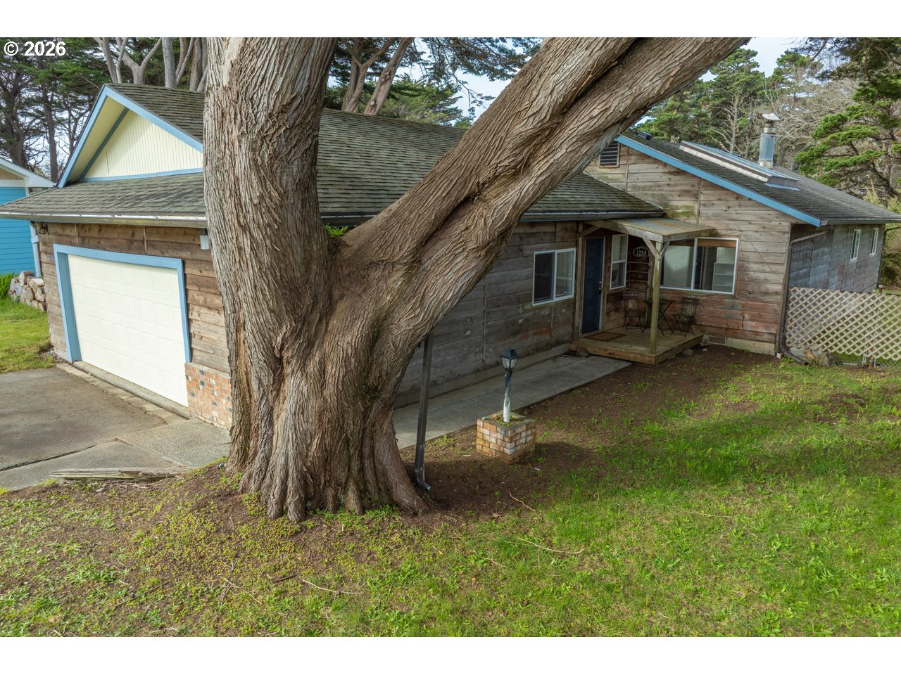 1260 Jackson Avenue Southwest Bandon, OR 97411 - Photo 5 of 48 a view of a house with a backyard