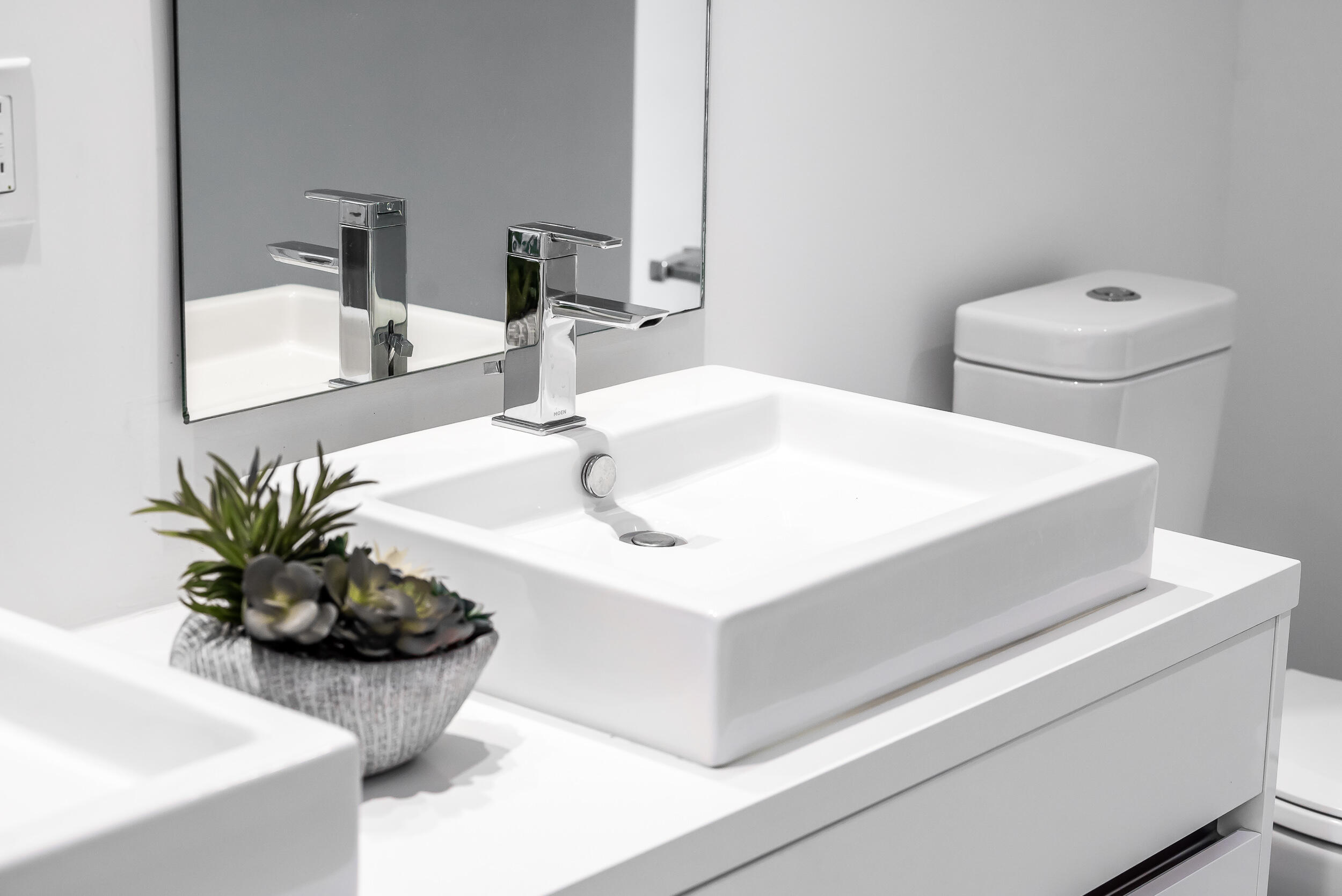 155 East Boca Raton Road, Unit 303 Boca Raton, FL 33432 - Photo 16 of 38 a bathroom with a sink and a mirror