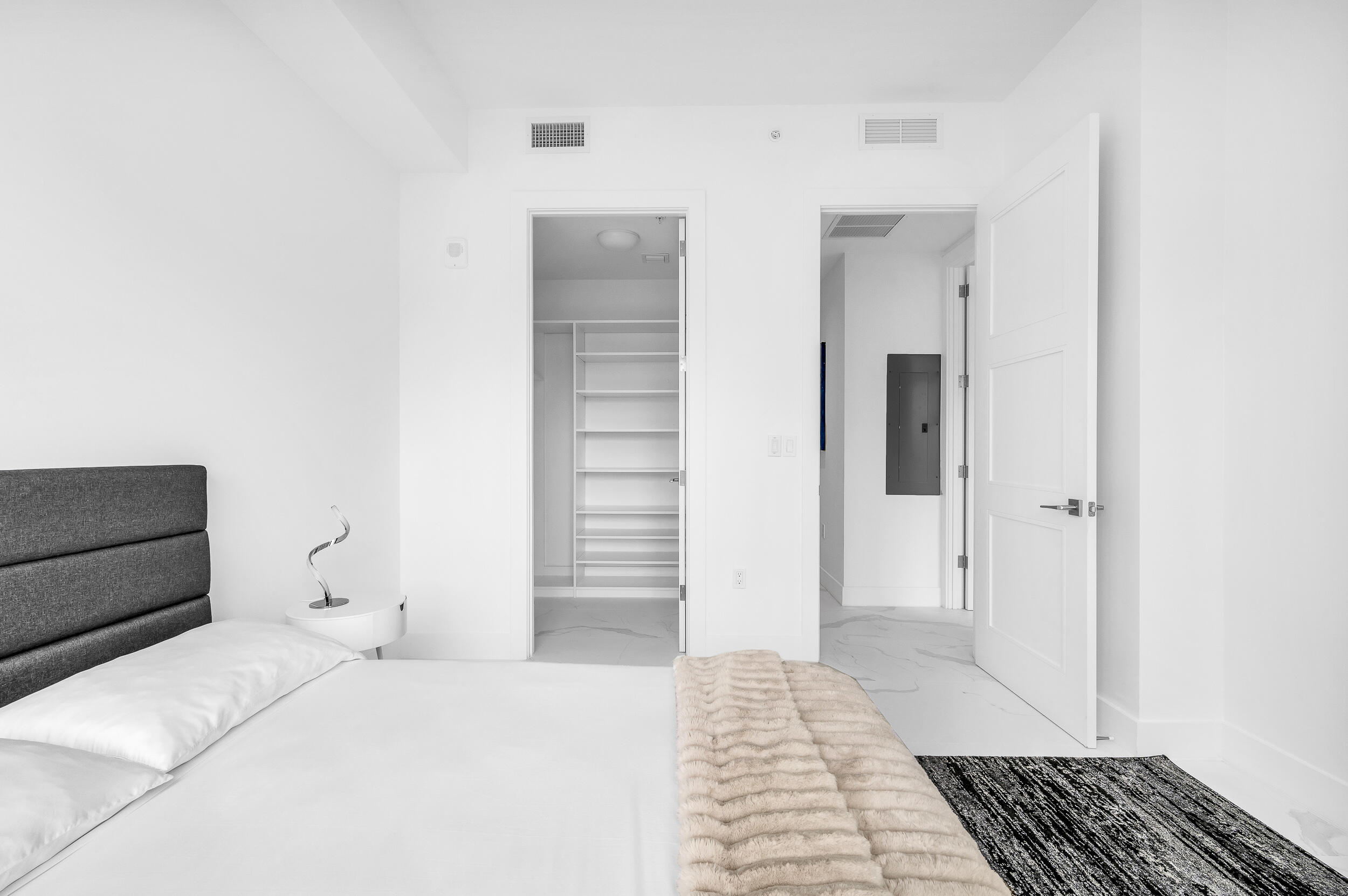 155 East Boca Raton Road, Unit 303 Boca Raton, FL 33432 - Photo 20 of 38 a bedroom with a bed and cabinets