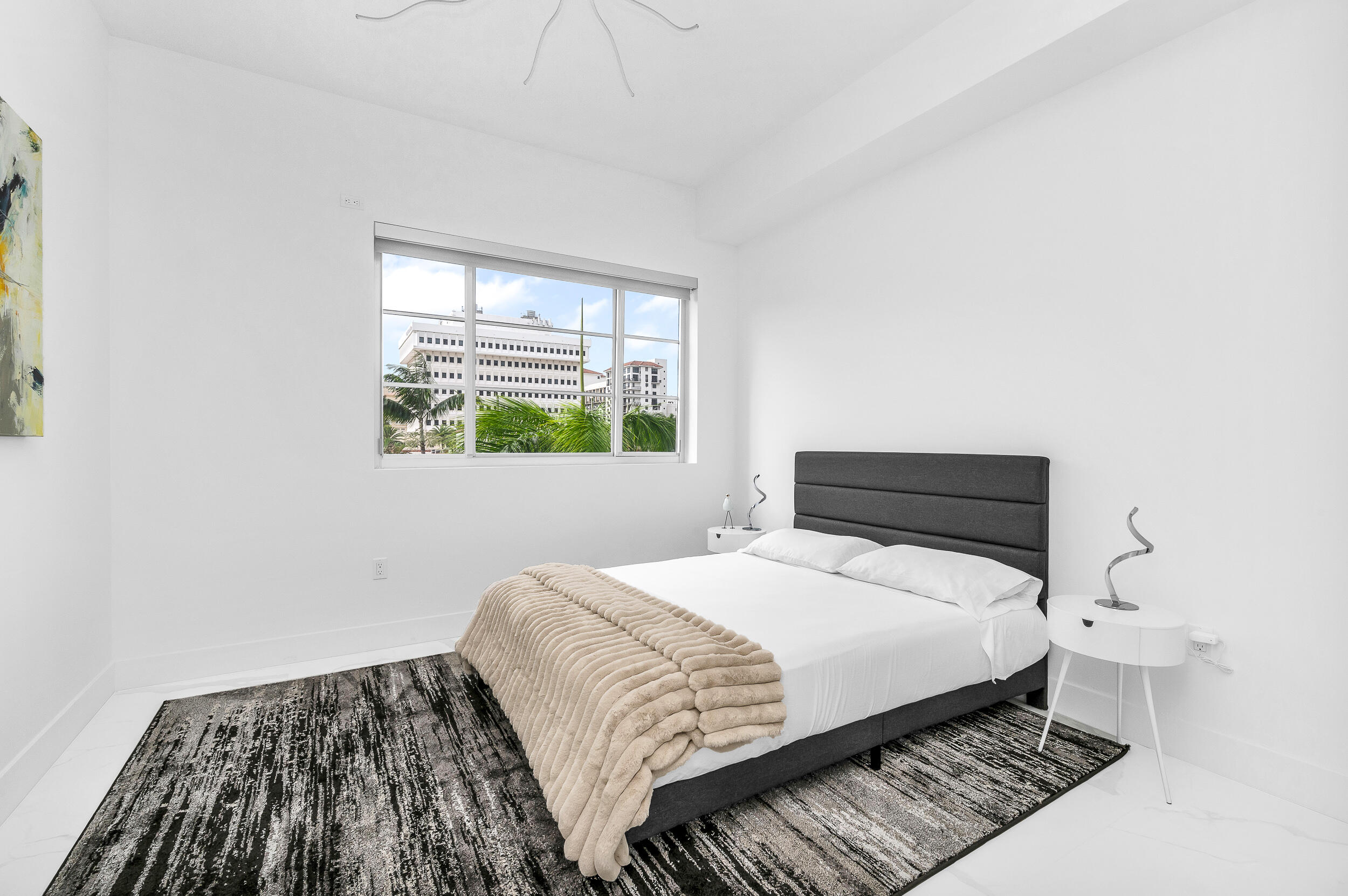 155 East Boca Raton Road, Unit 303 Boca Raton, FL 33432 - Photo 23 of 38 a bedroom with a bed and a window