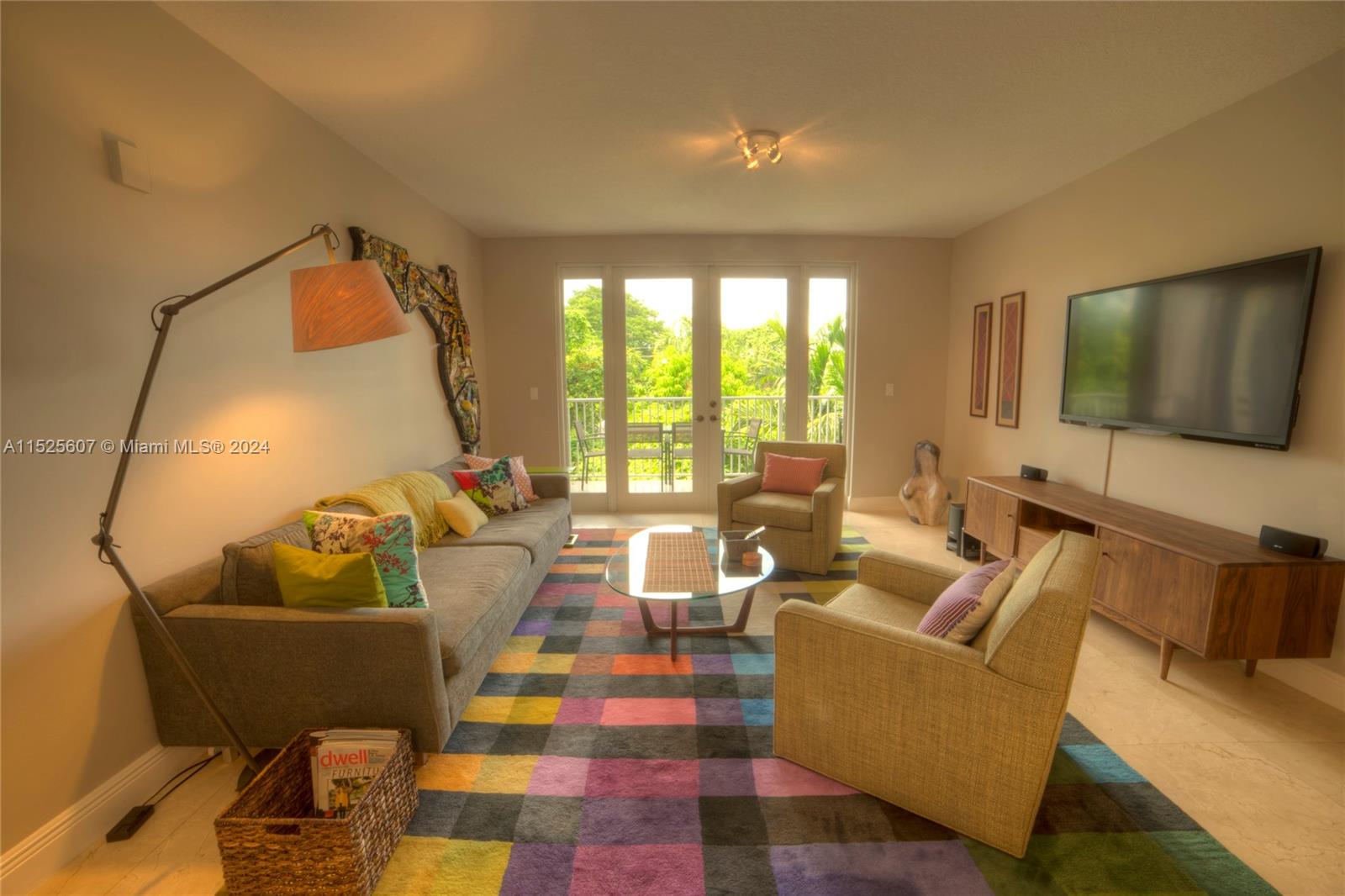 3540 Main Highway, Unit 305 Miami, FL 33133 - Photo 2 of 14 a living room with furniture and a flat screen tv