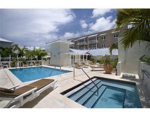 3540 Main Highway, Unit 305 Miami, FL 33133 - Photo 7 of 14 a view of a patio with swimming pool