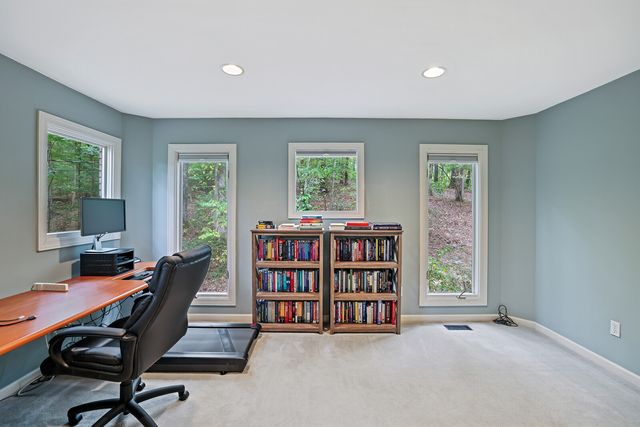 a bathroom with a sink vanity mirror and toilet