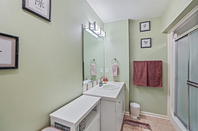 a view of entryway with wooden floor and stairs