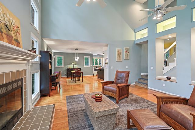 a living room with furniture fireplace and window