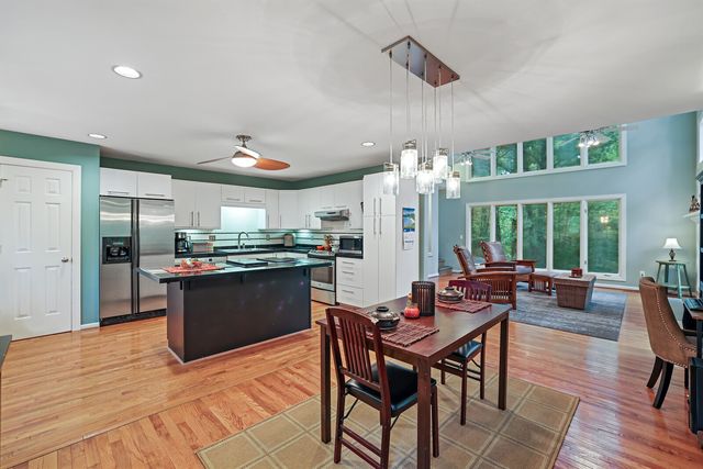 a kitchen with counter top space cabinets and stainless steel appliances