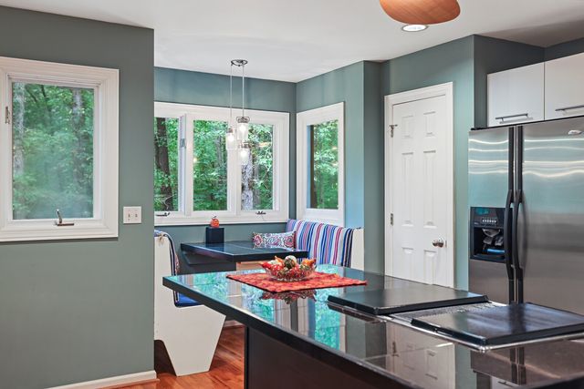 a view of livingroom with furniture and a flat screen tv