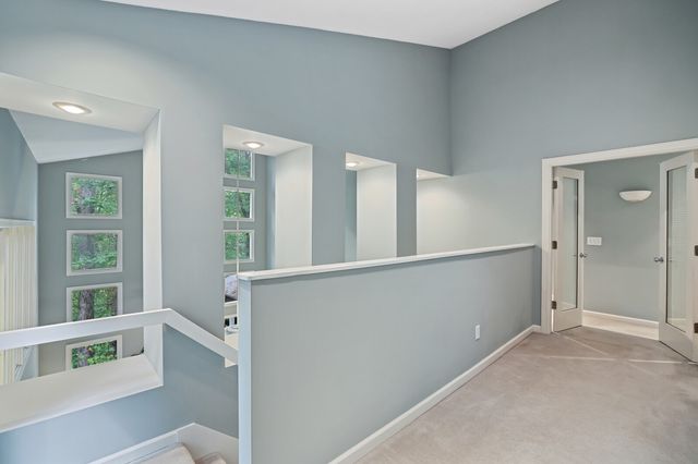 a bedroom with furniture and a flat screen tv