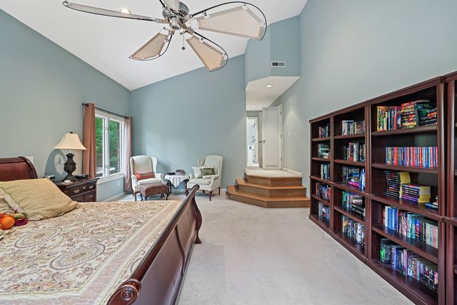 a bathroom with a tub sink and window