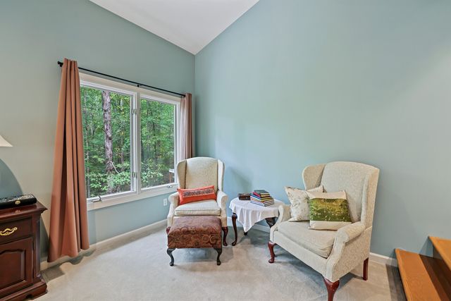 a bathroom with a bathtub and a window