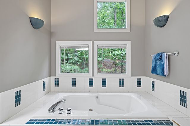 a balcony with furniture and wooden floor