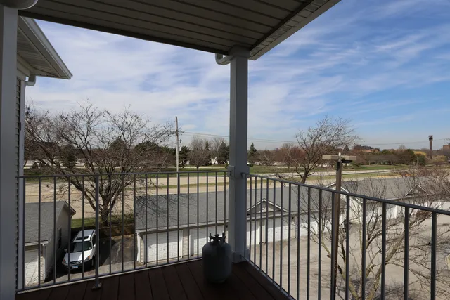 a view of a balcony with city view