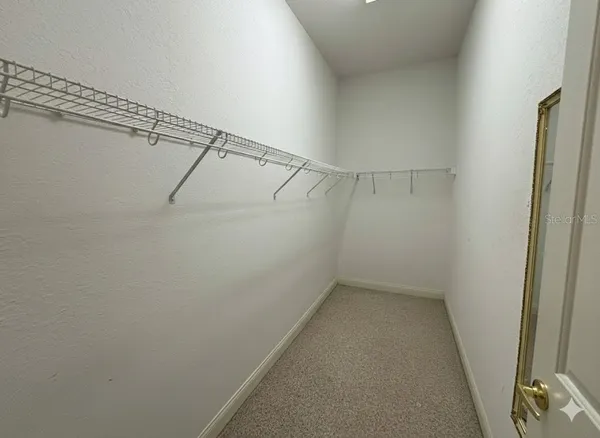 a view of a room with racks on the wall