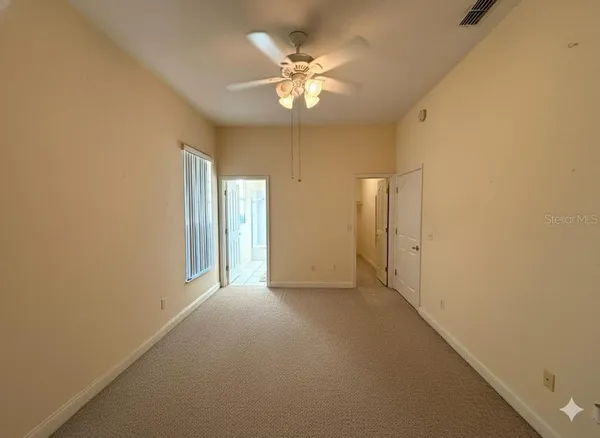 a view of an empty room with a window